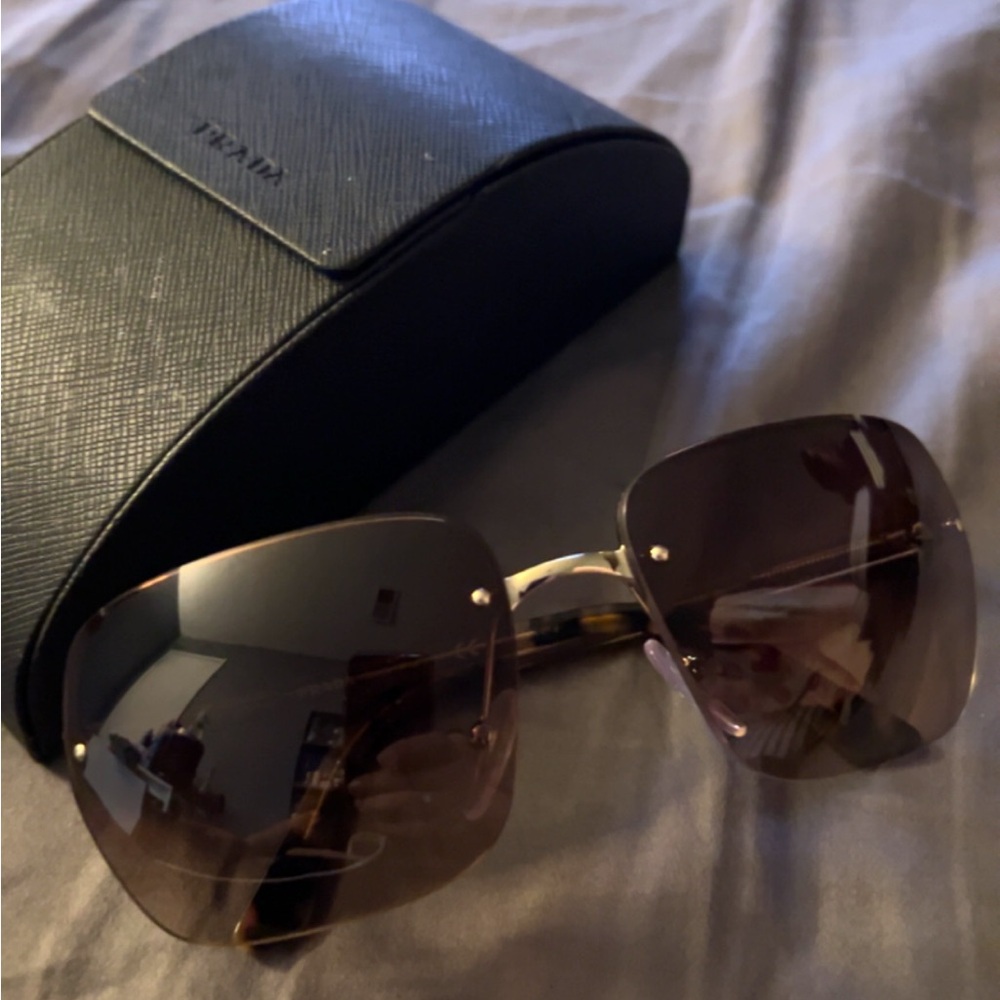 Prada Brown Frameless Glasses with Gold Accents